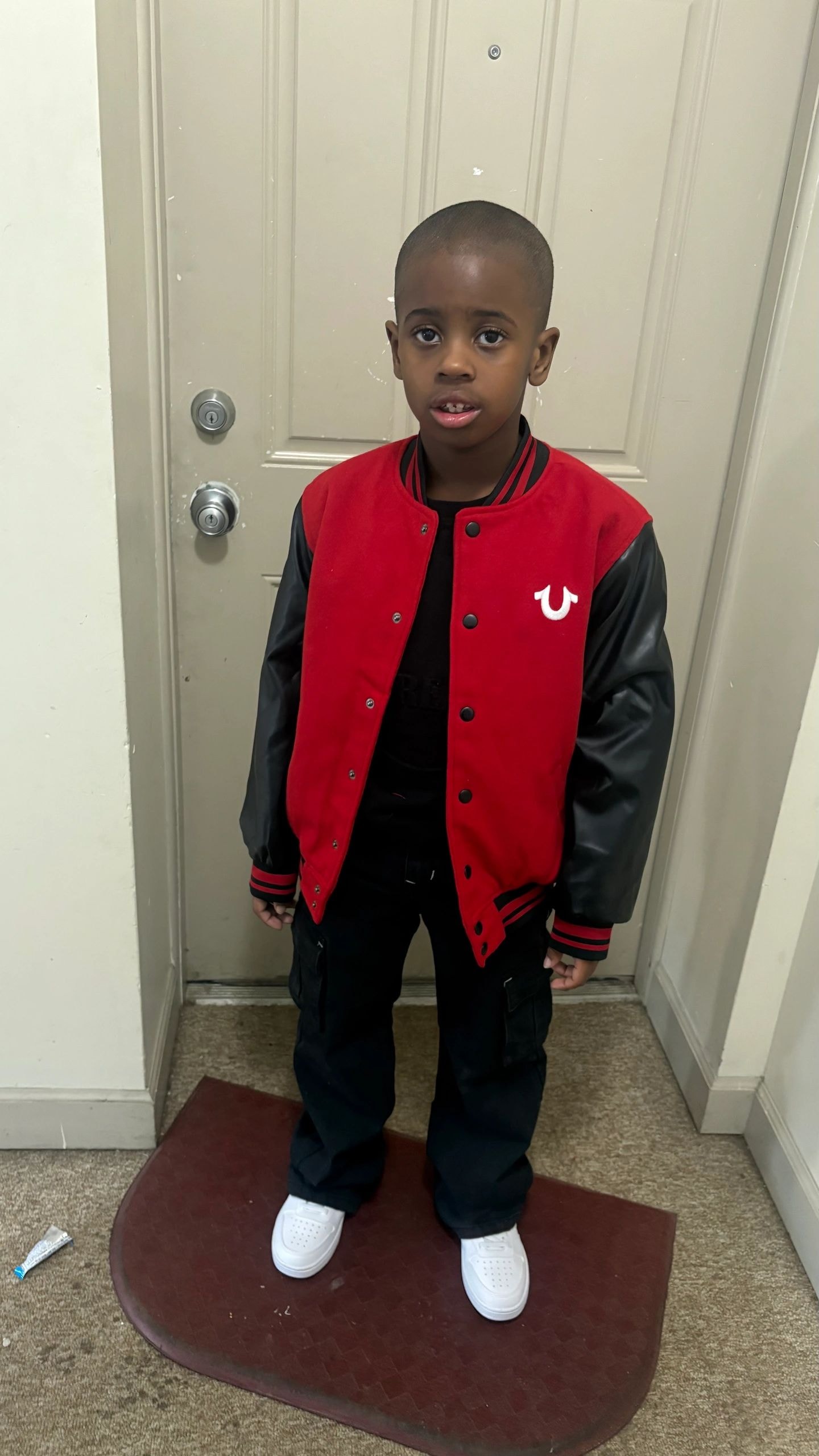 Kameryn in varsity jacket